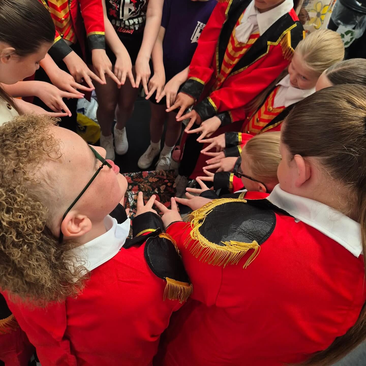 The Bodyrockers team gathered in a huddle